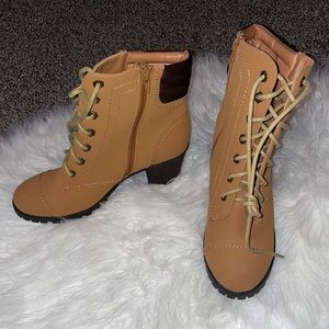 NWT size 10 brown boots with black soles.